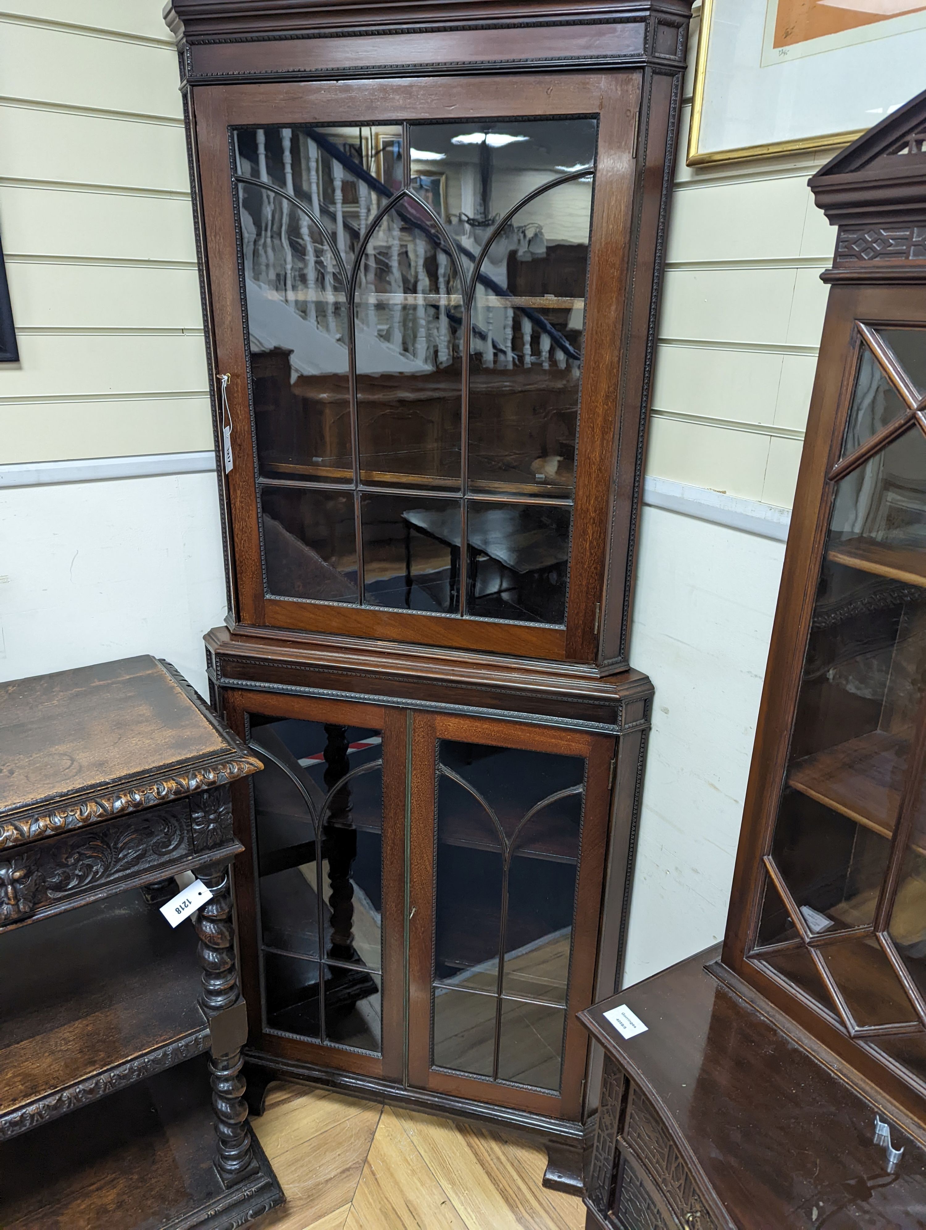 An Edwardian mahogany glazed standing corner cabinet, fitted four shelves, width 80cm, depth 42cm, height 196cm